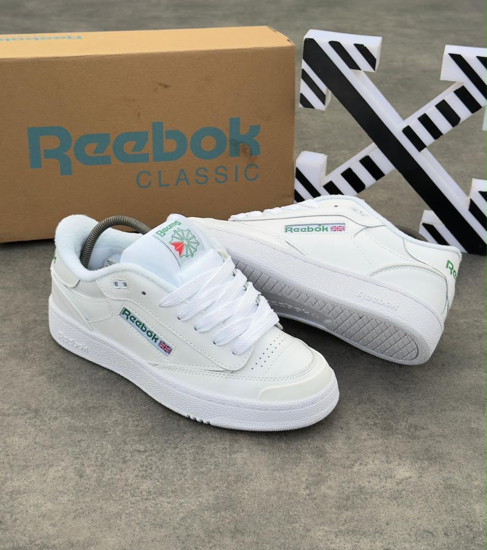 Reebok Classic Club C 85 sneakers in triple white with green branding and Union Jack detail — Swingdot Luxe