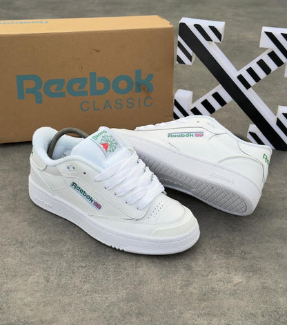 Reebok Classic Club C 85 sneakers in triple white with green branding and Union Jack detail — Swingdot Luxe