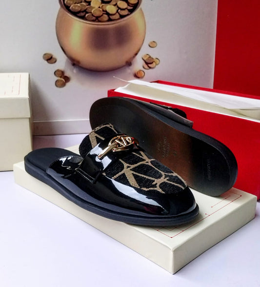 Valentino Garavani black patent leather and Toile Iconographe jacquard mule slides with gold VLogo hardware, smooth black leather insole, and black rubber sole displayed against Valentino red box — 100% authentic men's luxury slides