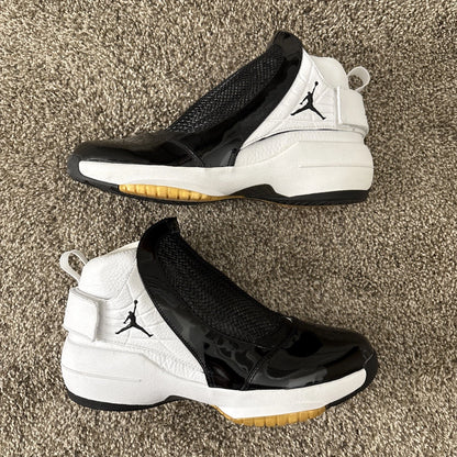 Nike Air Jordan 19 OG high-top sneakers in white and black Tuxedo colourway with patent leather toe cap, carbon fibre midfoot cage, black Jumpman logo, and translucent gum outsole — 100% authentic collector Jordan sneakers